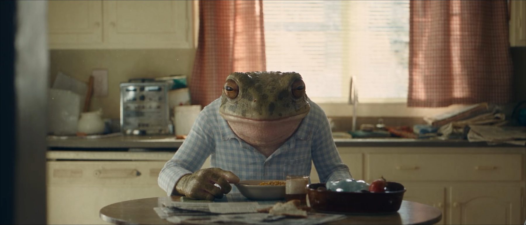 Full Time — the frog eating alone at the kitchen table