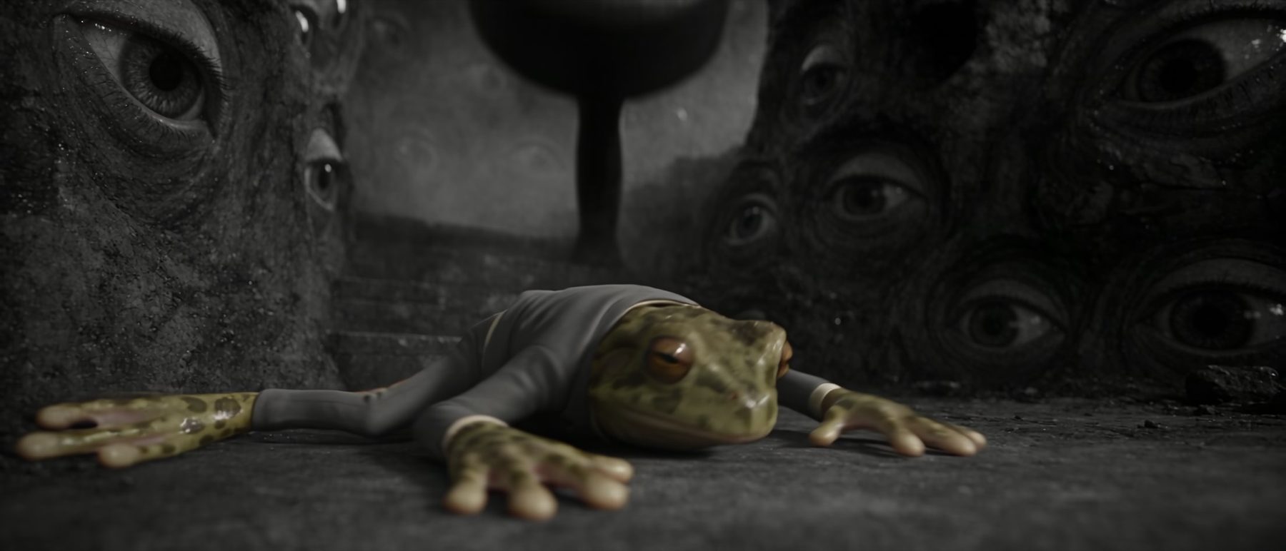 A frog lying on the ground before a wall of eyes