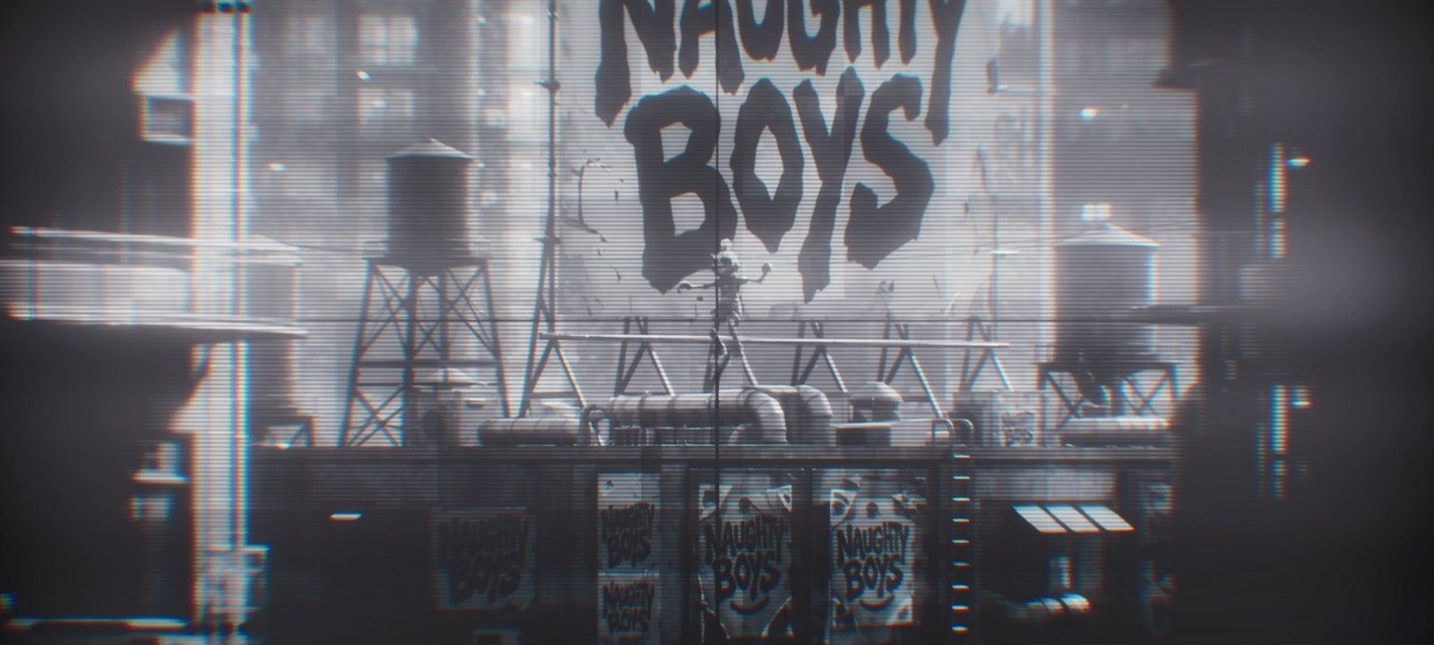 A lone figure balances on a beam in front of an enormous hand-painted NAUGHTY BOYS wall mural, water towers and stacked product boxes below